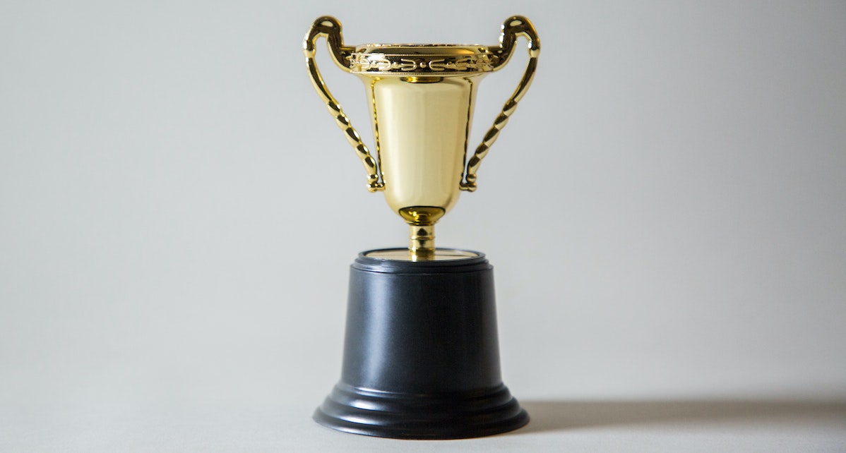 giorgio-trovato-_XTY6lD8jgM-unsplash gold trophy with black base