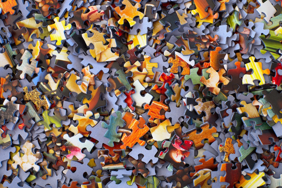 hans-peter-gauster-3y1zF4hIPCg-unsplash Pile of colorful puzzle pieces
