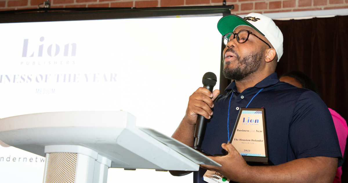 2023 LION Awards Award winner stands at podium on stage